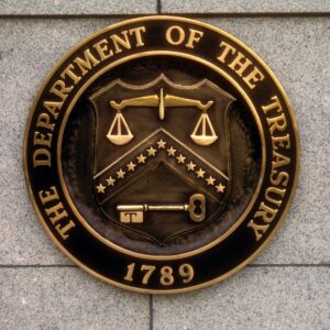 seal of the U.S. department of the treasury on building exterior