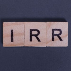 Scrabble tiles lined up to spell IRR