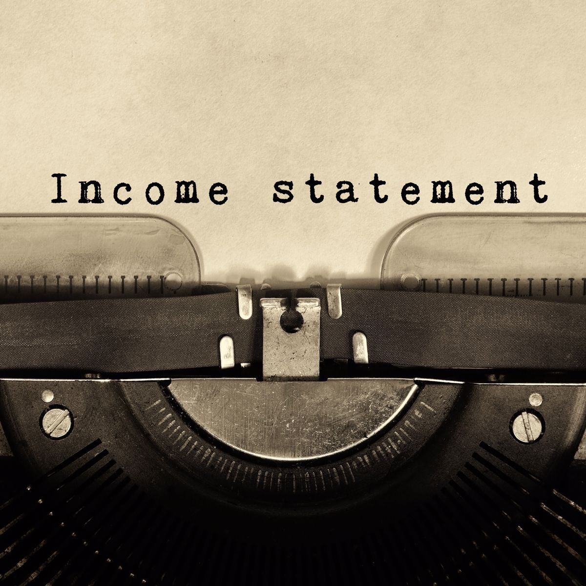 Words "Income Statement" written by a typewriter.